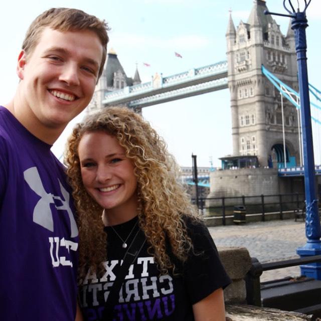 A female and male student standing in front of Tower Bridge in London